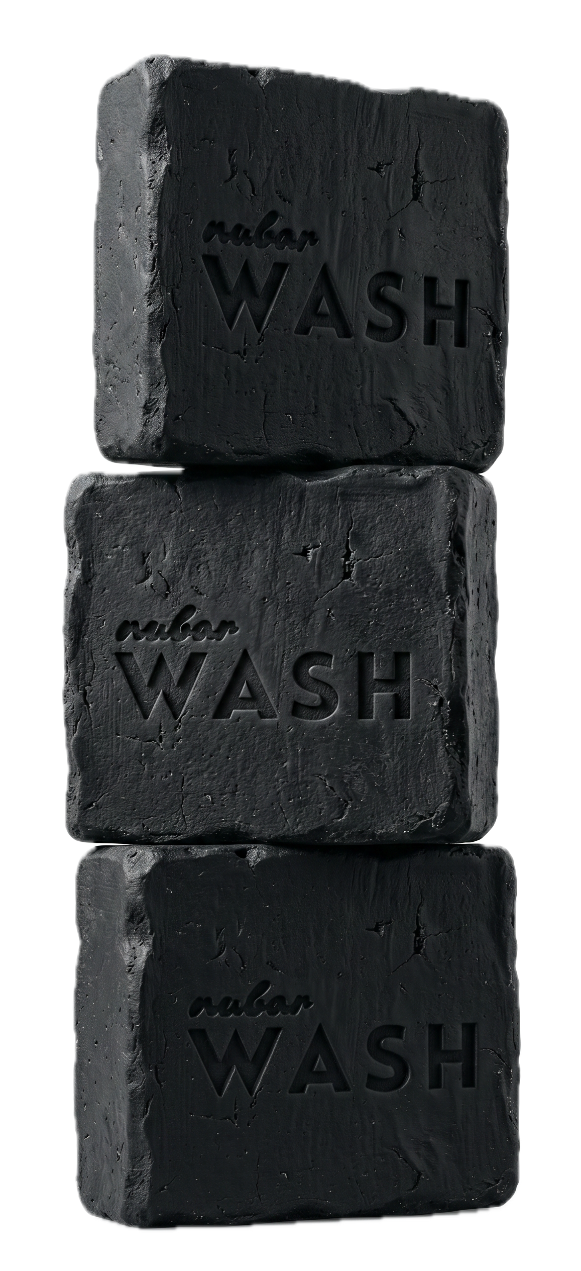Three blocks of black soap labeled 'nubar wash' stacked